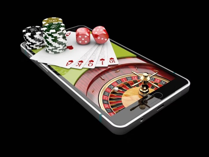 Tampilan permainan Ganesha Gold menunjukkan 5 gulungan dengan simbol mitologi dan fitur bonus di maxwin500